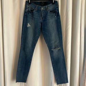 Lucky Brand denim. Size 27/4. Skinny jean. Distressing at knee.